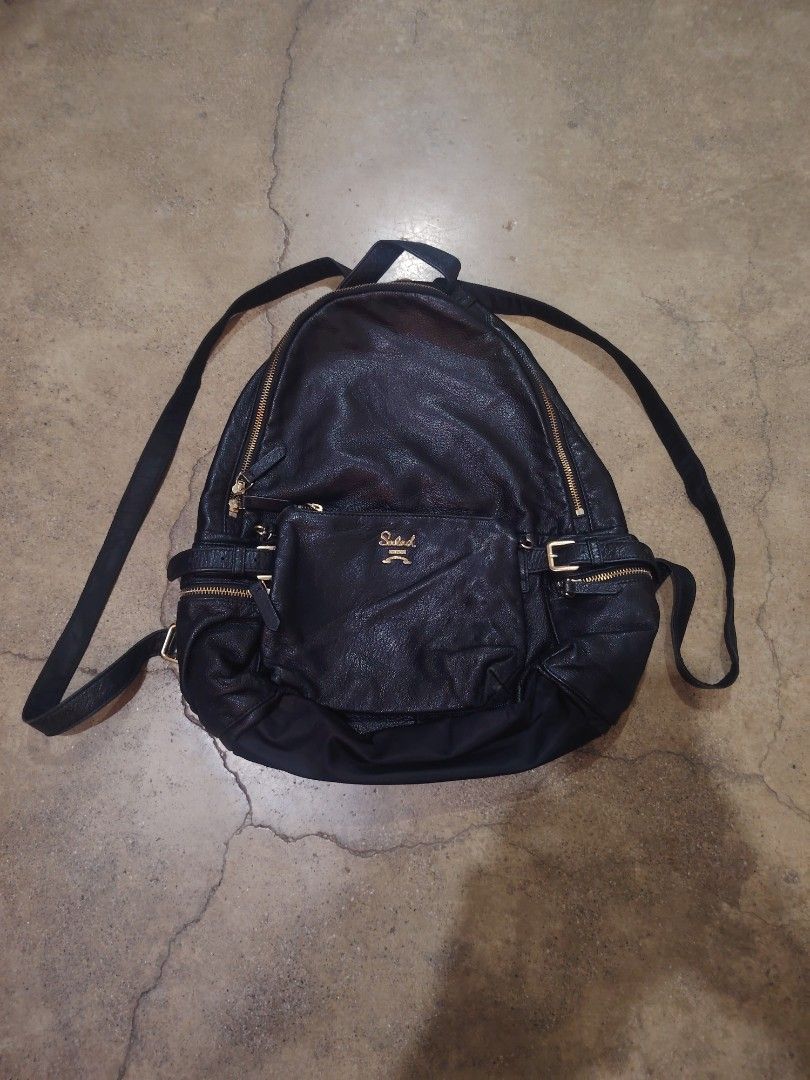 Salad Black Faux Leather Backpack Gold Hardware (Category: Backpacks) located in San Jose del Monte. Submitted by klowiboy (Listing ID 1461366409, Image 1). Description: - Brand: Salad - Material: Faux Leather - Color: Black - Hardware: Gold zippers and buckles - Features: Front zip pocket, adjustable straps - Style: Versatile, great for everyday or travel - Interior: Plenty of space Excellent Condition✅️ 10/10 Color Rate✅ Dimes: W15 L17 inches 9