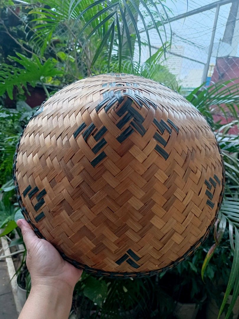 Salakot (Category: Hats & Beanies) located in Manila. Submitted by mecaart (Listing ID 1461414025, Image 3). Description: - Traditional conical hat, expertly handwoven from natural bamboo. - Features a stylish dark trim around the brim for a classic look. - Decorative accents on the crown add a unique touch. - Ideal for effective sun protection during outdoor activities. - Also serves as a beautiful decorative piece for your home. - Each hat is a
