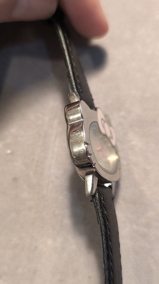 Sanrio Hello Kitty Japan Quartz Watch (Category: Women's Watches) located in Mandaluyong City. Submitted by ceremonialgradewatcha (Listing ID 1461485773, Image 2). Description: Sanrio Hello Kitty Japan Quartz Watch 🔋Quartz movement - working condition. May need battery replacement. 🟢 Aftermarket leather strap 📍 Location: Highway Hills, Mandaluyong 🛵 Lalamove or J&T nationwide shipping (c/o buyer) 🔷 ISSUE: Some hairline scratches on the bezel