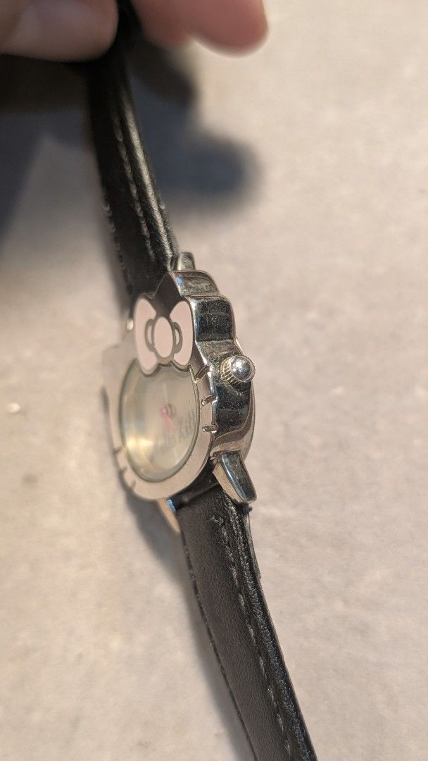 Sanrio Hello Kitty Japan Quartz Watch (Category: Women's Watches) located in Mandaluyong City. Submitted by ceremonialgradewatcha (Listing ID 1461485773, Image 3). Description: Sanrio Hello Kitty Japan Quartz Watch 🔋Quartz movement - working condition. May need battery replacement. 🟢 Aftermarket leather strap 📍 Location: Highway Hills, Mandaluyong 🛵 Lalamove or J&T nationwide shipping (c/o buyer) 🔷 ISSUE: Some hairline scratches on the bezel