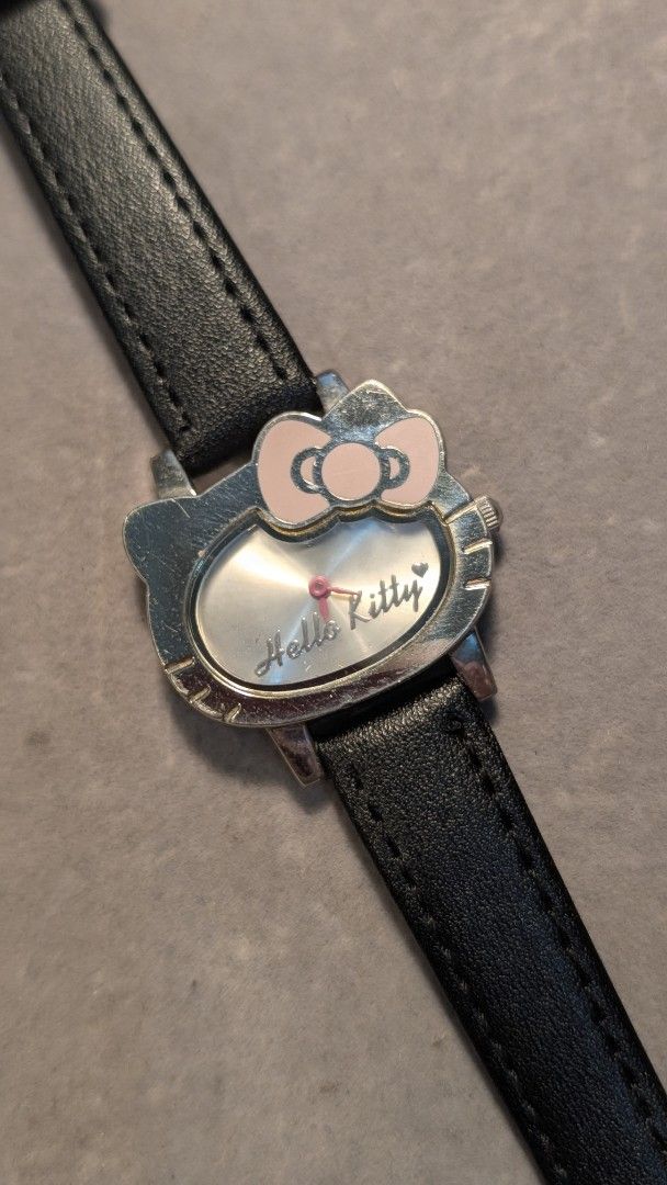 Sanrio Hello Kitty Japan Quartz Watch (Category: Women's Watches) located in Mandaluyong City. Submitted by ceremonialgradewatcha (Listing ID 1461485773, Image 1). Description: Sanrio Hello Kitty Japan Quartz Watch 🔋Quartz movement - working condition. May need battery replacement. 🟢 Aftermarket leather strap 📍 Location: Highway Hills, Mandaluyong 🛵 Lalamove or J&T nationwide shipping (c/o buyer) 🔷 ISSUE: Some hairline scratches on the bezel