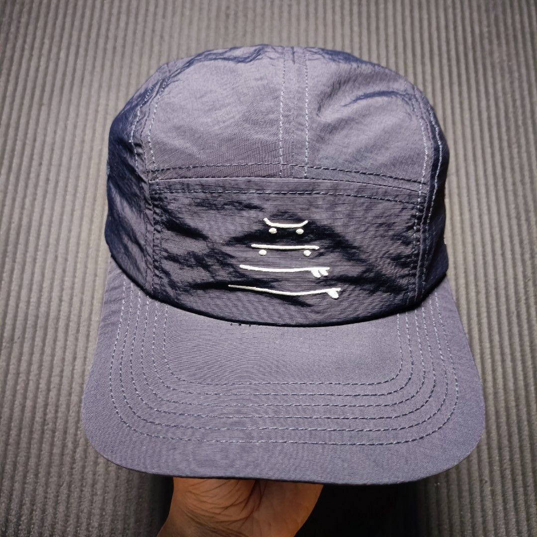 Santoloco 5 Pannel skate & surf (Category: Caps & Hats) located in Manila. Submitted by nye.seller (Listing ID 1461494012, Image 1). Description: - Brand: Santoloco - Skate & surf apparel - Color: Navy Blue - Style: 5-Panel Cap - Material: 100% Nylon - Features: Graphic design on front panel, embroidered logo on side - Fit: Adjustable strap at the back - Ideal for: Everyday wear.