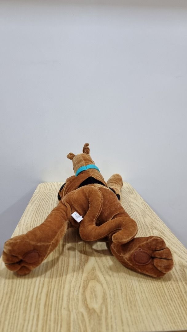 Scooby-Doo Plush Toy - Large Brown Dog (Category: Plushies & Soft Toys) located in Paranaque City. Submitted by olxph_668280920 (Listing ID 1461492272, Image 2). Description: - Big Scooby-Doo plush toy - Approximately 2 feet long - Classic brown color with signature blue collar and black spots - Great for Scooby-Doo fans - Ideal for cuddling or display - Ready for a new home.
