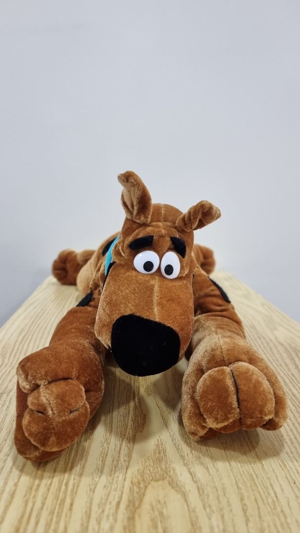 Scooby-Doo Plush Toy - Large Brown Dog (Category: Plushies & Soft Toys) located in Paranaque City. Submitted by olxph_668280920 (Listing ID 1461492272, Image 1). Description: - Big Scooby-Doo plush toy - Approximately 2 feet long - Classic brown color with signature blue collar and black spots - Great for Scooby-Doo fans - Ideal for cuddling or display - Ready for a new home.