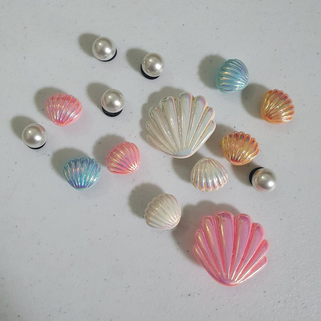 Seashell & Pearl Shoe Charms for Crocs Jibbitz (Category: Charms) located in Paranaque City. Submitted by cobien (Listing ID 1461469691, Image 1). Description: - Cute seashell and pearl charms for shoes. - Adds a fun, beachy vibe. - Easy to attach to Crocs or similar footwear. - Get a mix of different styles and colors. - Perfect for summer customization..