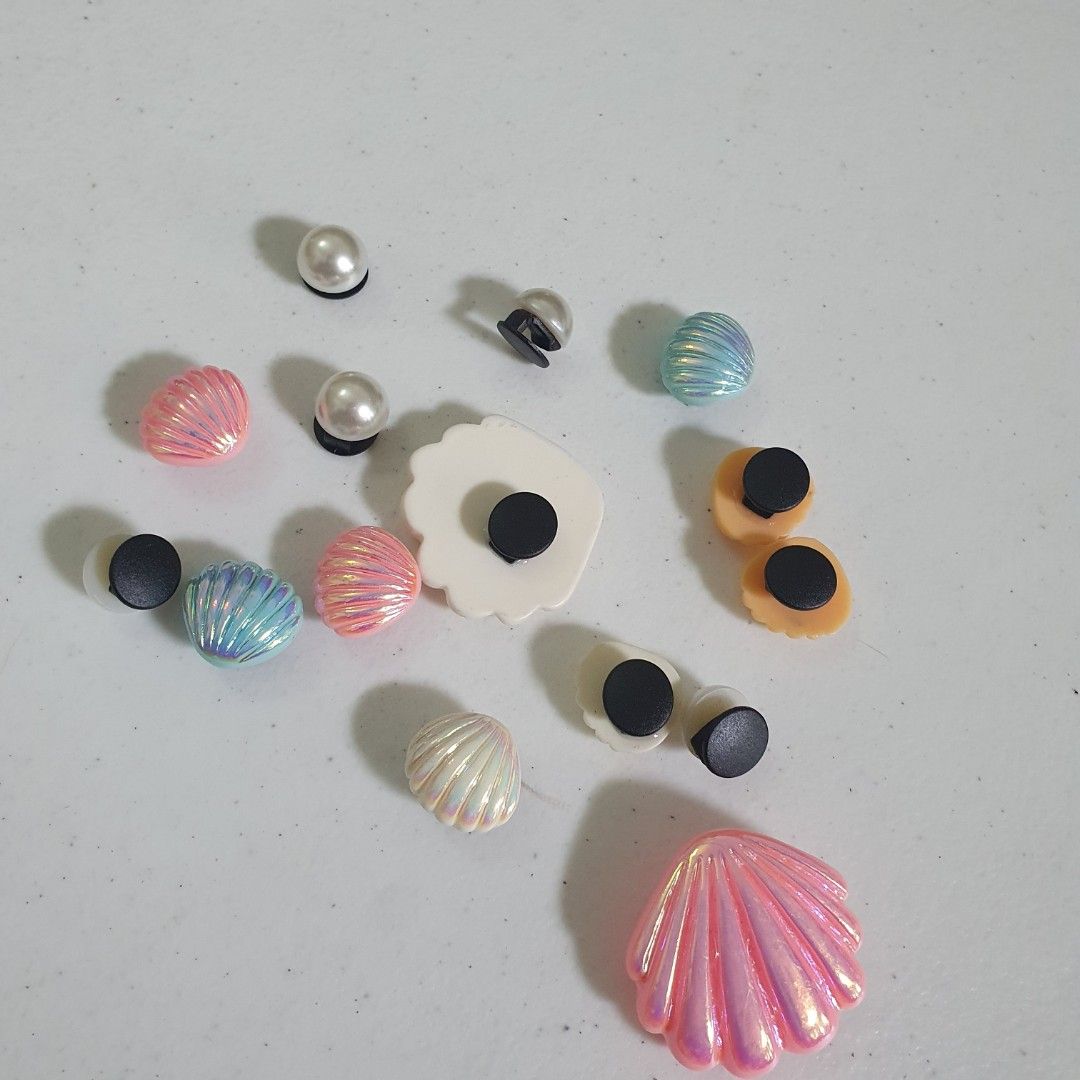 Seashell & Pearl Shoe Charms for Crocs Jibbitz (Category: Charms) located in Paranaque City. Submitted by cobien (Listing ID 1461469691, Image 2). Description: - Cute seashell and pearl charms for shoes. - Adds a fun, beachy vibe. - Easy to attach to Crocs or similar footwear. - Get a mix of different styles and colors. - Perfect for summer customization..