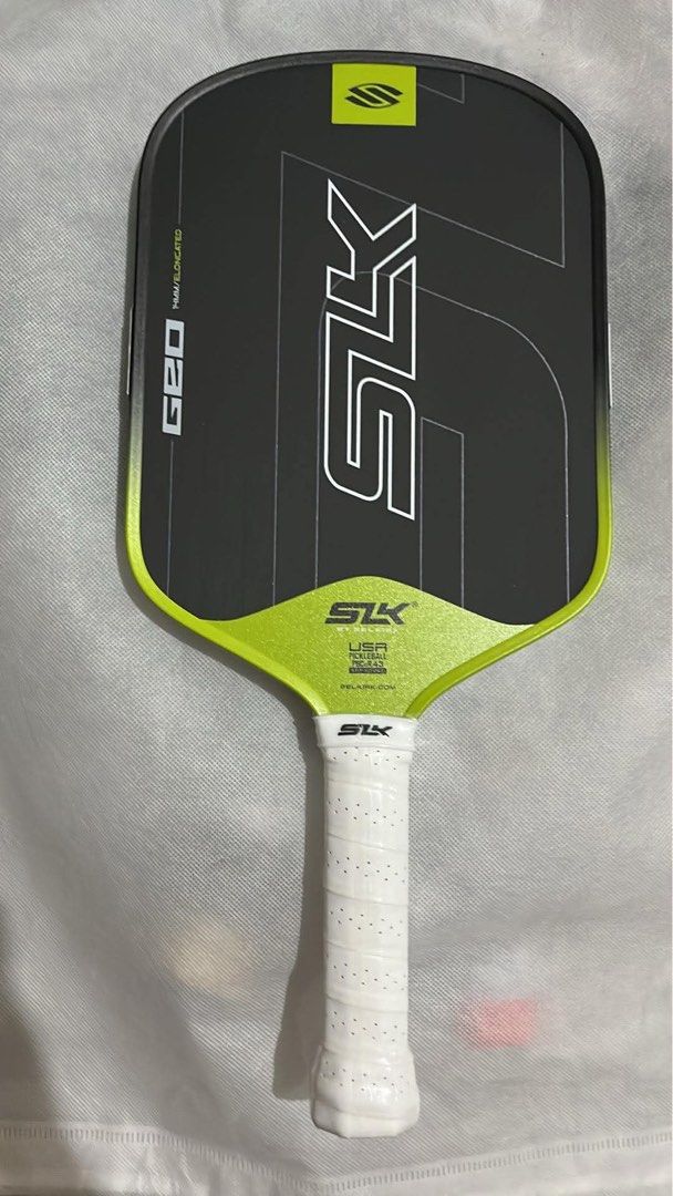 Selkirk SLK Geo Pickleball Paddle (Category: Racket and Ball Sports) located in Manila. Submitted by pickleball_paddles (Listing ID 1461355285, Image 3). Description: - Selkirk SLK Geo elongated pickleball paddle - Stylish black, pink, and green design - Comfortable white grip - Offers a balanced feel for versatile play - Perfect for your next pickleball match.