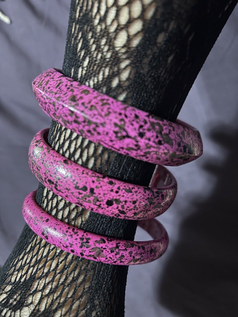 Set of 3 Pink Speckled Bangles (Category: Bracelets) located in Pasig City. Submitted by mixpicks (Listing ID 1461363638, Image 1). Description: - Set of 3 pink bangles - Black speckled pattern - Unique, textured finish - Fun statement pieces - Can be stacked or worn individually - Adds a pop of color to any outfit.