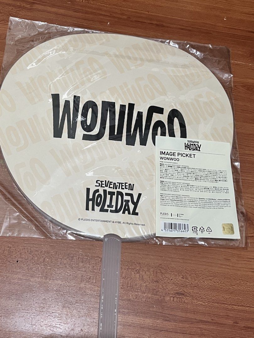 SEVENTEEN HOLIDAY WONWOO IMAGE PICKET (Category: K-Wave Merchandise) located in Bacoor. Submitted by craftkies (Listing ID 1461504723, Image 2). Description: - SEVENTEEN Holiday Image Picket featuring Wonwoo - Round fan with handle - Front: Large photo of Wonwoo - Back: SEVENTEEN HOLIDAY logo and 'WONWOO' repeated - Brand new, still in original packaging - Ideal for any SEVENTEEN fan (Carat).
