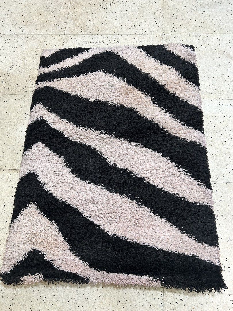 Shaggy Zebra Print Rug - Black and Beige (Category: Carpets, Mats & Flooring) located in Paranaque City. Submitted by pyassszzzi (Listing ID 1461365310, Image 1). Description: - Fun vibe for any room - Bold zebra print (black & beige stripes) - Soft and plush underfoot - Great for living rooms, bedrooms, or play areas - Easy to clean.