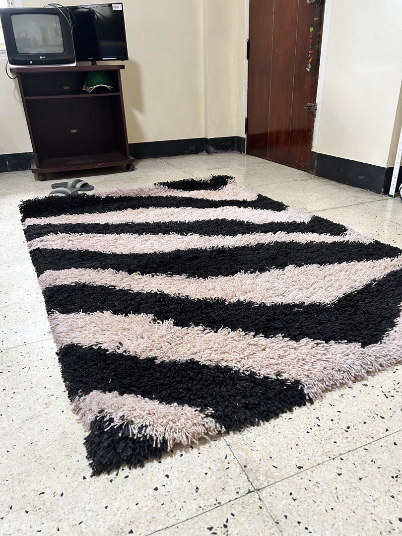 Shaggy Zebra Print Rug - Black and Beige (Category: Carpets, Mats & Flooring) located in Paranaque City. Submitted by pyassszzzi (Listing ID 1461365310, Image 2). Description: - Fun vibe for any room - Bold zebra print (black & beige stripes) - Soft and plush underfoot - Great for living rooms, bedrooms, or play areas - Easy to clean.