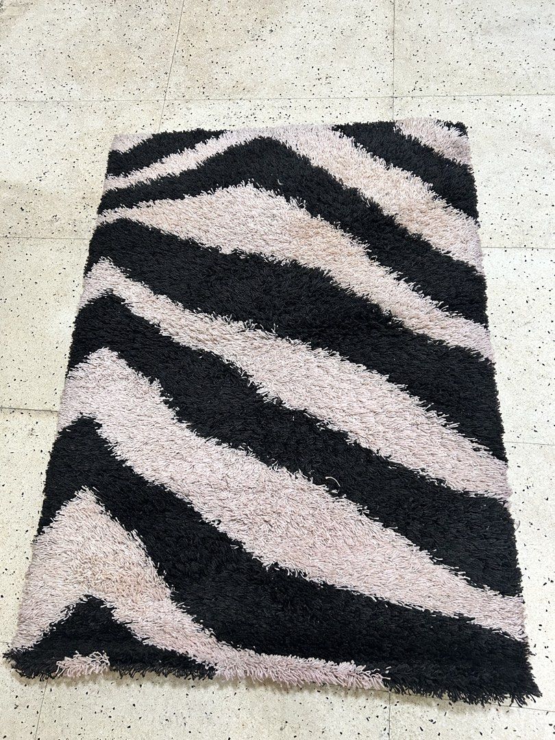 Shaggy Zebra Print Rug - Black and Beige (Category: Carpets, Mats & Flooring) located in Paranaque City. Submitted by pyassszzzi (Listing ID 1461365310, Image 3). Description: - Fun vibe for any room - Bold zebra print (black & beige stripes) - Soft and plush underfoot - Great for living rooms, bedrooms, or play areas - Easy to clean.