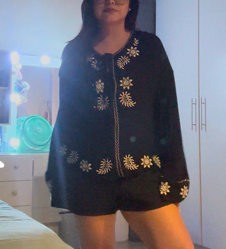 SHEIN Black Embroidered Long Sleeve Top (Category: Blouses) located in Pasig City. Submitted by iivyclutters (Listing ID 1461512404, Image 3). Description: - Black long sleeve top - White embroidery detail - Tie-neck feature - Embroidered cuffs - Versatile: pairs well with jeans or shorts - Comfortable and stylish for casual outings.
