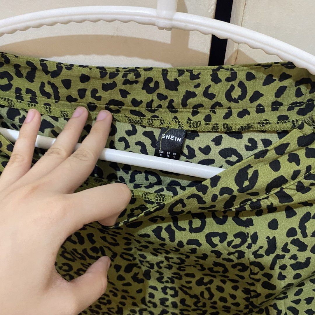 Green Leopard Print Slit Midi Skirt (Category: Skirts) located in Bacolor. Submitted by mxspicychicken (Listing ID 1461347368, Image 3). Description: - SHEIN Green Midi Skirt - Eye-catching black leopard print - Flattering side slit - Size S - Perfect for dressing up or down.