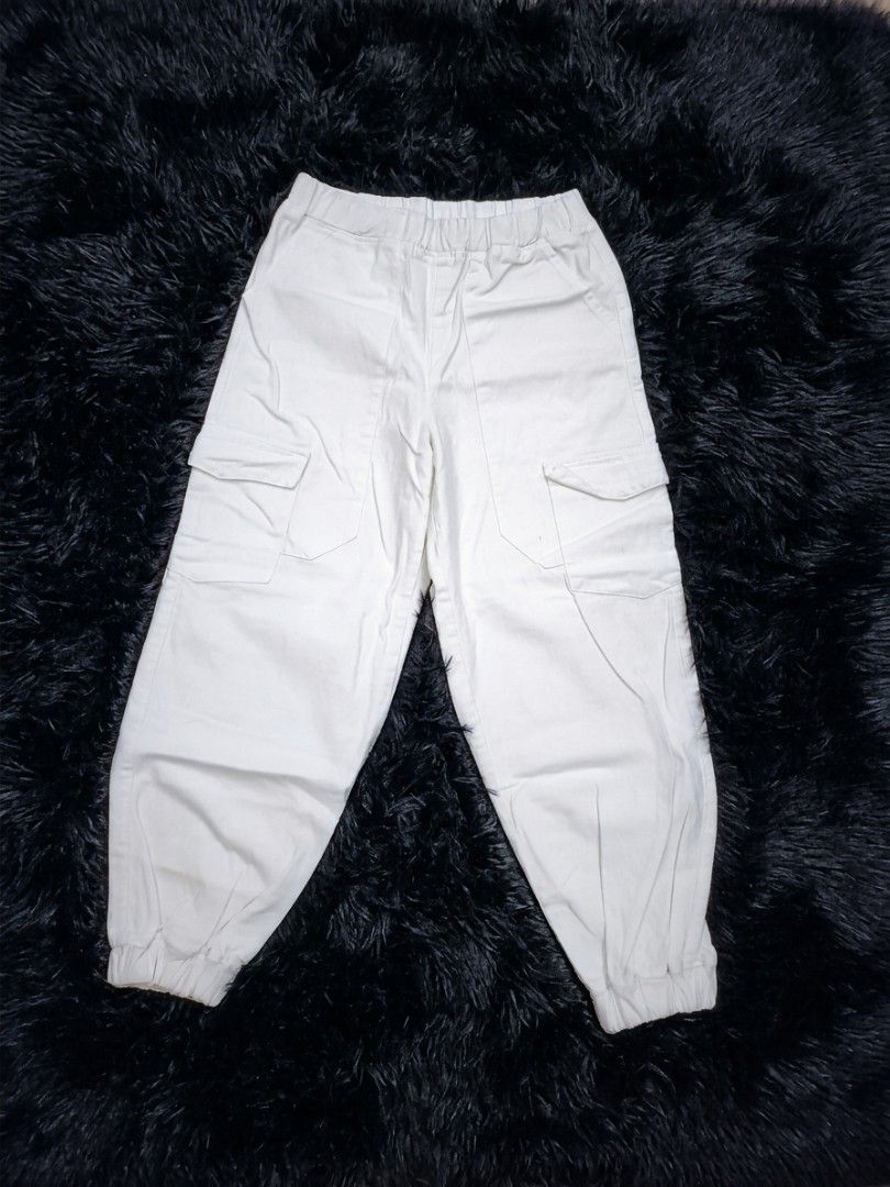 SHEIN White Cargo Jogger Pants (small on tag) (Category: Other Bottoms) located in Manila. Submitted by babeboxtheory (Listing ID 1461371168, Image 1). Description: - Stylish white cargo jogger pants - Comfortable elastic waistband with adjustable drawstring - Two convenient side pockets - Two functional cargo pockets on the legs - Trendy cuffed ankles - Perfect for everyday casual wear.