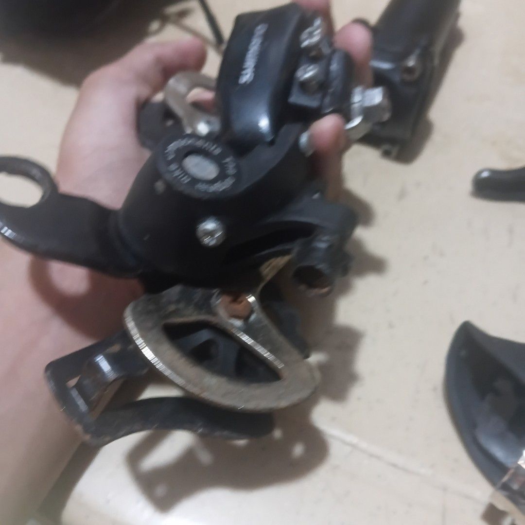 Shimano Bicycle Rear Derailleur (Category: Bicycles) located in Manila. Submitted by wise_jp (Listing ID 1461514711, Image 2). Description: - Genuine Shimano rear derailleur - Fully functional and working condition - Ideal for replacing a worn-out or damaged derailleur - Selling 'as is' - what you see is what you get.