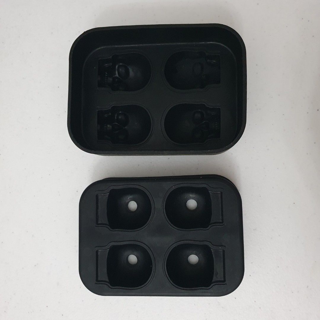 Skull Tray Silicone Mold (Category: Other Kitchenware & Tableware) located in Paranaque City. Submitted by cobien (Listing ID 1461391668, Image 3). Description: - Black silicone mold tray - Makes 4 unique skull-shaped ice cubes - Perfect for parties and adding fun to drinks - Made from flexible, easy-to-clean silicone - not food safe as there is no indication.