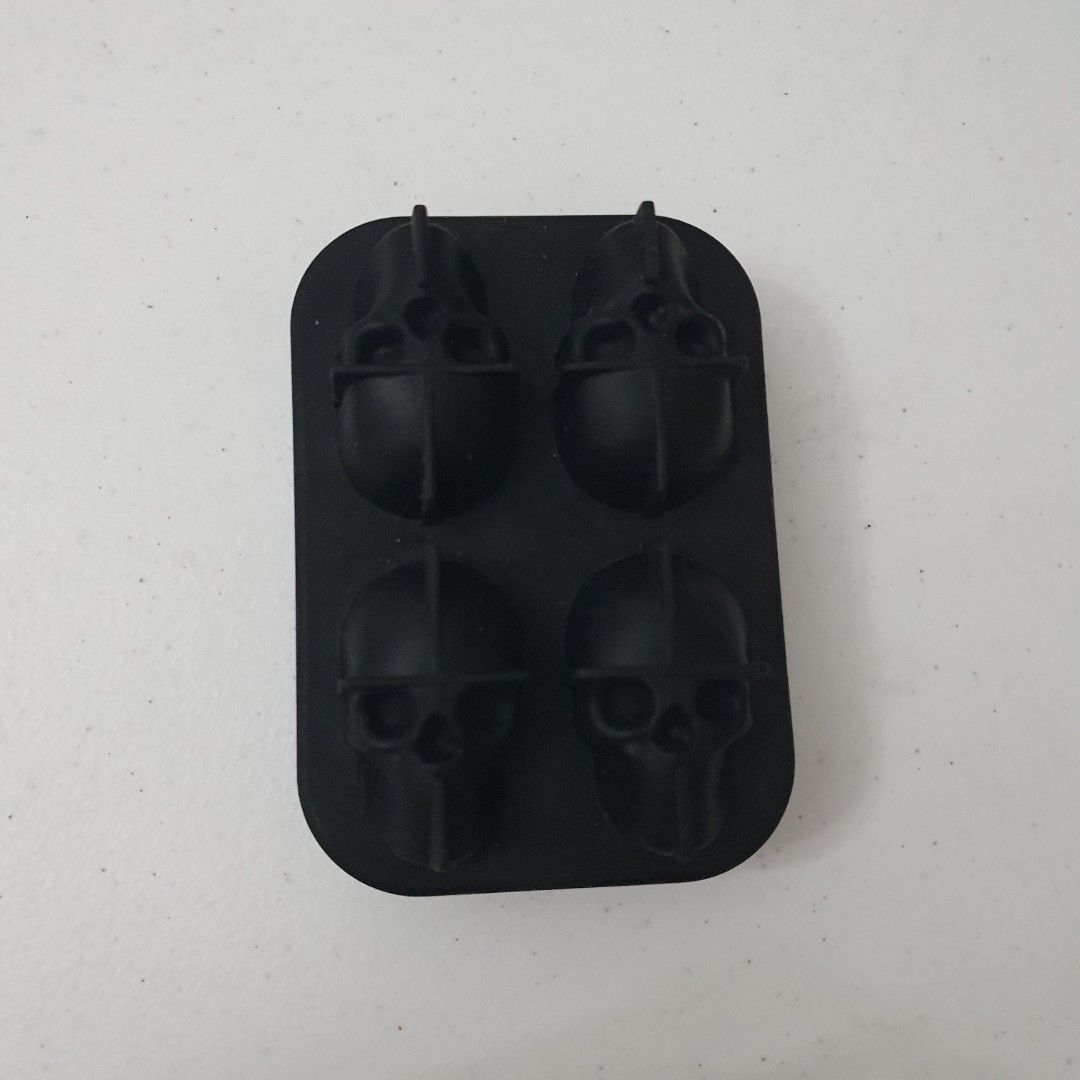 Skull Tray Silicone Mold (Category: Other Kitchenware & Tableware) located in Paranaque City. Submitted by cobien (Listing ID 1461391668, Image 1). Description: - Black silicone mold tray - Makes 4 unique skull-shaped ice cubes - Perfect for parties and adding fun to drinks - Made from flexible, easy-to-clean silicone - not food safe as there is no indication.