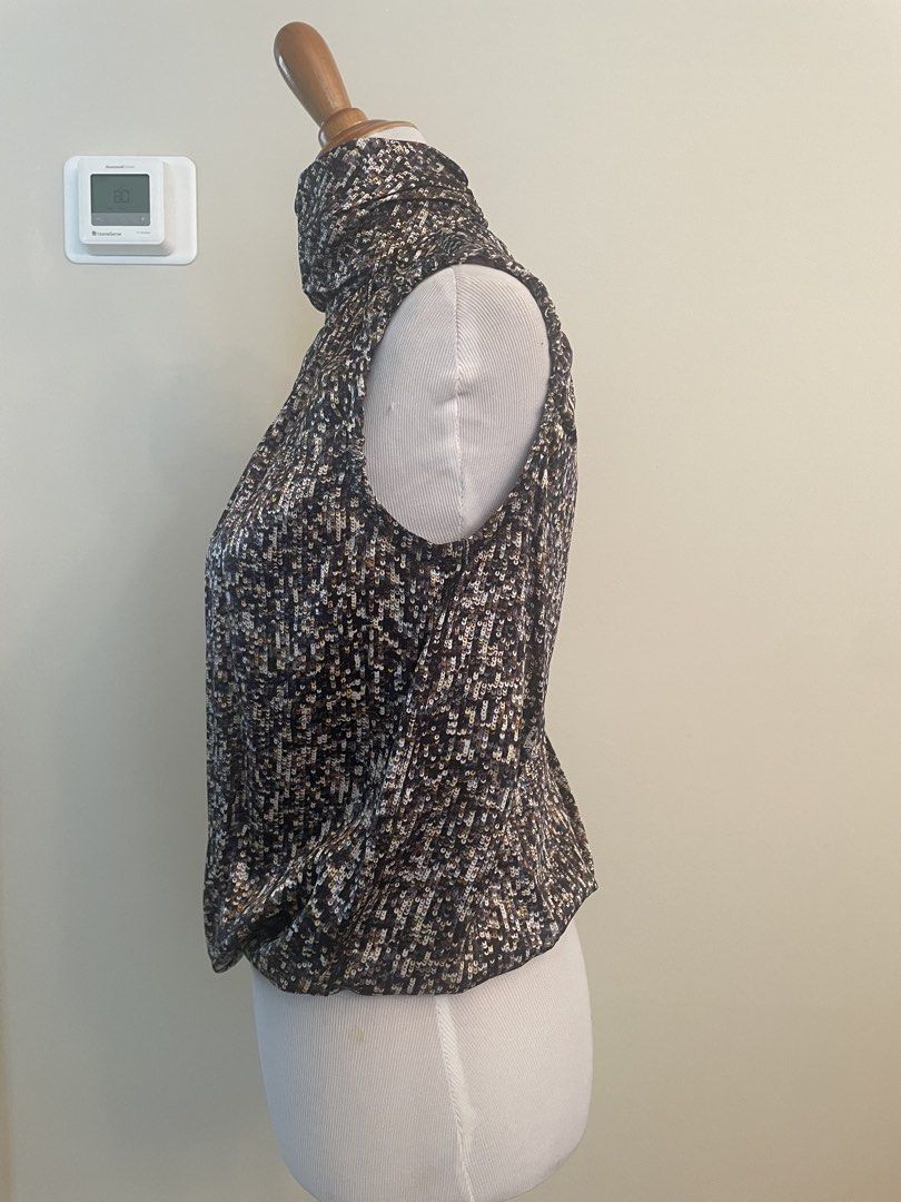 Sleeveless Mock Neck Top with Sequin-like Pattern D&G (Category: Sleeveless) located in Makati City. Submitted by cheapipie (Listing ID 1461407894, Image 2). Description: - Sleeveless mock neck top/ 100%Silk - Dark fabric with scattered sequin/bead-like pattern - Back closure - Ruched neckline detail - Versatile for dressing up or down.