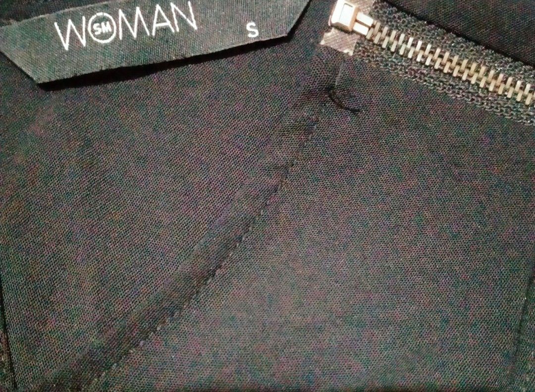 SM Woman Top (Category: Sleeveless) located in Quezon City. Submitted by wisdomsophia (Listing ID 1461431456, Image 2). Description: Black loose sleeveless top with a front fabric tie detail that can be styled and tied at the lower front, giving it a simple yet stylish look.