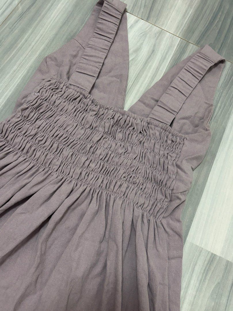 Smocked V-Neck Mini Dress (Category: Dresses) located in Manila. Submitted by lovedbynabix (Listing ID 1461446074, Image 3). Description: Cute purple mini dress. Has a smocked bodice with a V-neckline. Straps are gathered. Great for casual wear or dressing up..