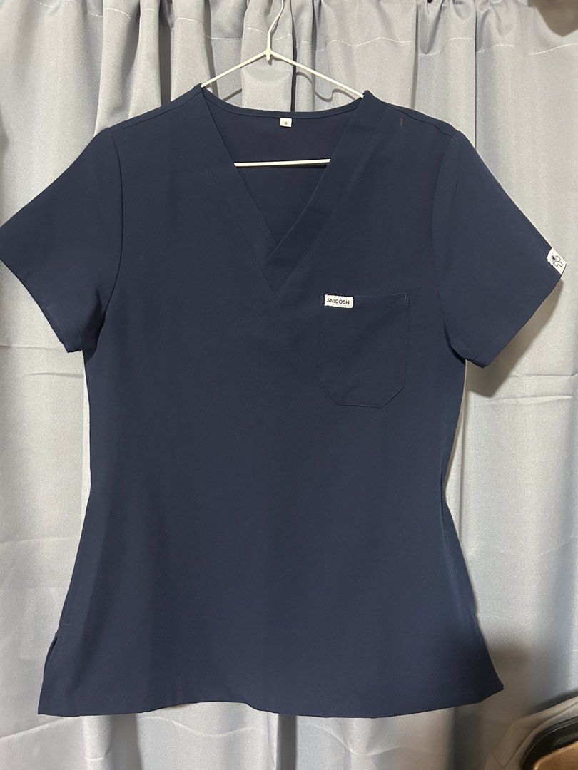 SNICOSH Scrub Top and Pants Set - Navy Blue (Category: Activewear) located in Tuguegarao City. Submitted by notacoolkid (Listing ID 1461481163, Image 2). Description: - Navy blue scrub set (top and pants) - V-neck scrub top with chest pocket - Scrub pants with drawstring waist and zippered pocket - Comfortable and practical for work.