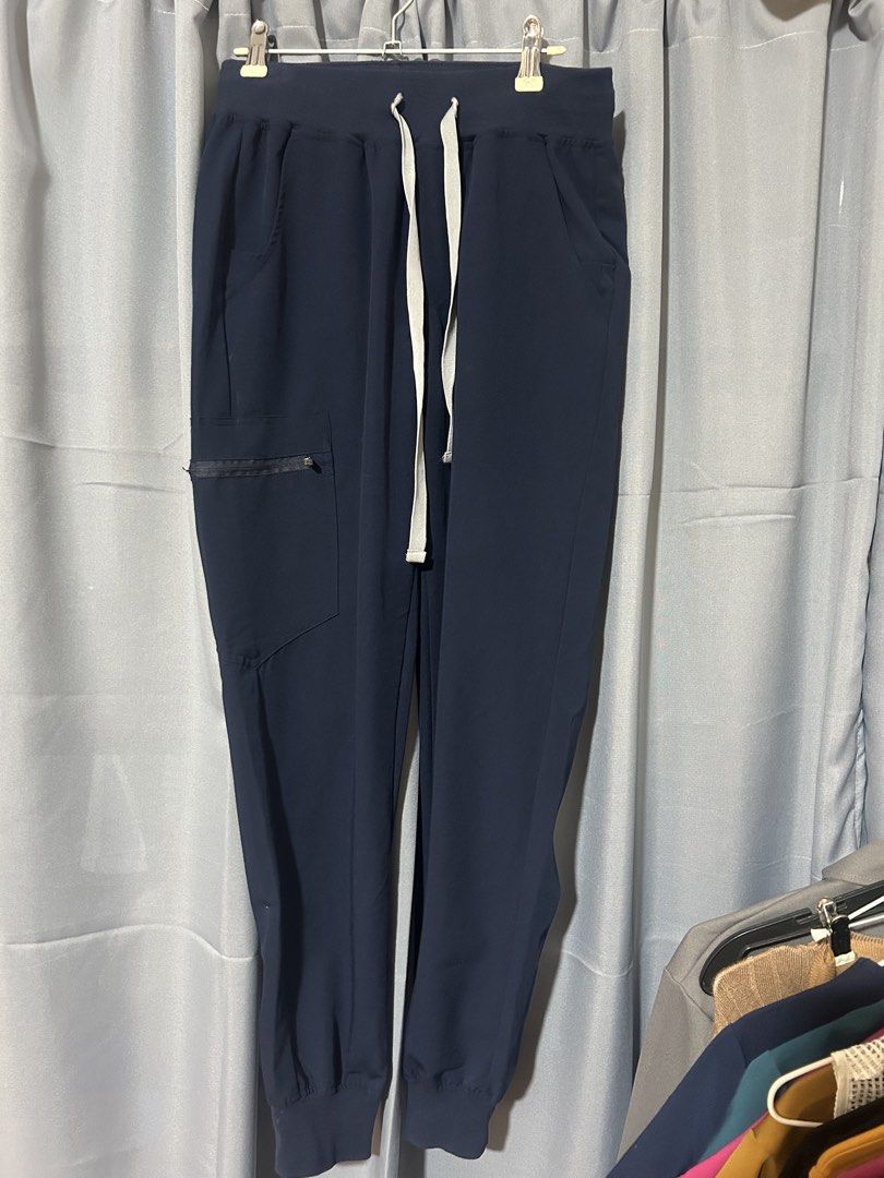 SNICOSH Scrub Top and Pants Set - Navy Blue (Category: Activewear) located in Tuguegarao City. Submitted by notacoolkid (Listing ID 1461481163, Image 3). Description: - Navy blue scrub set (top and pants) - V-neck scrub top with chest pocket - Scrub pants with drawstring waist and zippered pocket - Comfortable and practical for work.