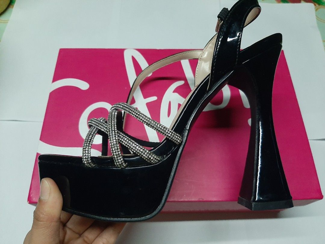 Sofab heels (Category: Heels) located in Guiset East. Submitted by aprilrosec37142 (Listing ID 1461476826, Image 3). Description: - never been used - Black patent platform heels - Sparkly rhinestone straps - Chunky flared heel - Ankle strap - Size 37 - Ideal for nights out or special occasions - Comes with original box.