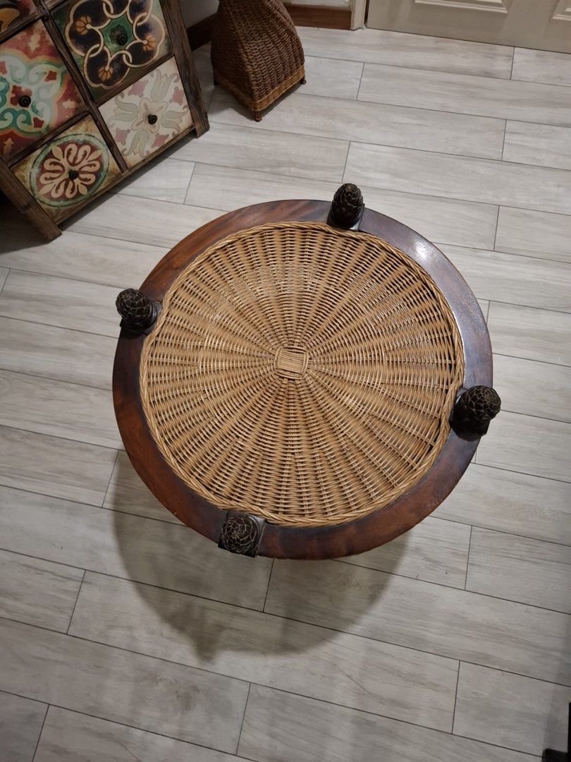 Solid wood coffee table (Category: Tables & Sets) located in Singapore. Submitted by shaa87 (Listing ID 1461464483, Image 2). Description: Round coffee table - 61cm diameter Solid wood with brown natural Ratten woven antic collection and 4 wooden pines at each quadrant. Selling off as not using often. Good home addition for wood loverss! Self- collection.