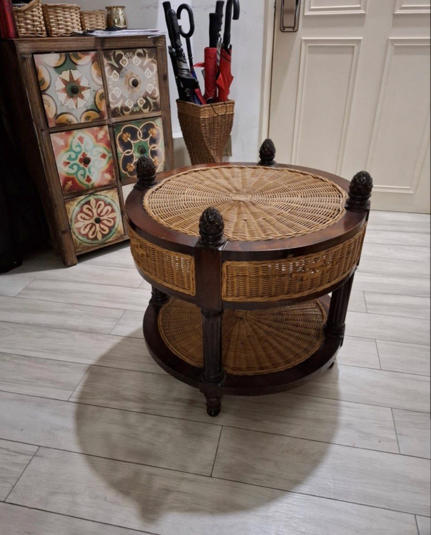 Solid wood coffee table (Category: Tables & Sets) located in Singapore. Submitted by shaa87 (Listing ID 1461464483, Image 1). Description: Round coffee table - 61cm diameter Solid wood with brown natural Ratten woven antic collection and 4 wooden pines at each quadrant. Selling off as not using often. Good home addition for wood loverss! Self- collection.