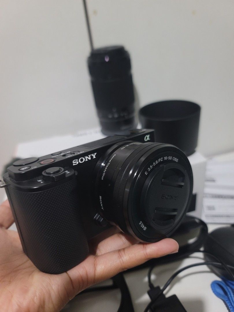 Sony ZV-E10 Complete Set with lenses and flash+accessories (Category: Cameras) located in Cabanatuan. Submitted by mjsabado74120 (Listing ID 1461361236, Image 1). Description: SONY ZV-E10 COMPLETE SET 855 Shutter Count Only✅ (3x lang nagamit sa travel) INCLUSIONS: Sony ZV-E10 Mirrorless Camera Body Sony E PZ 16-50mm F3.5-5.6 OSS Lens + Sony E 55-210mm F4.5-6.3 OSS Zoom Lens Sony NP-FW50 Rechargeable Battery Sony External Flash Windscreen Camera C