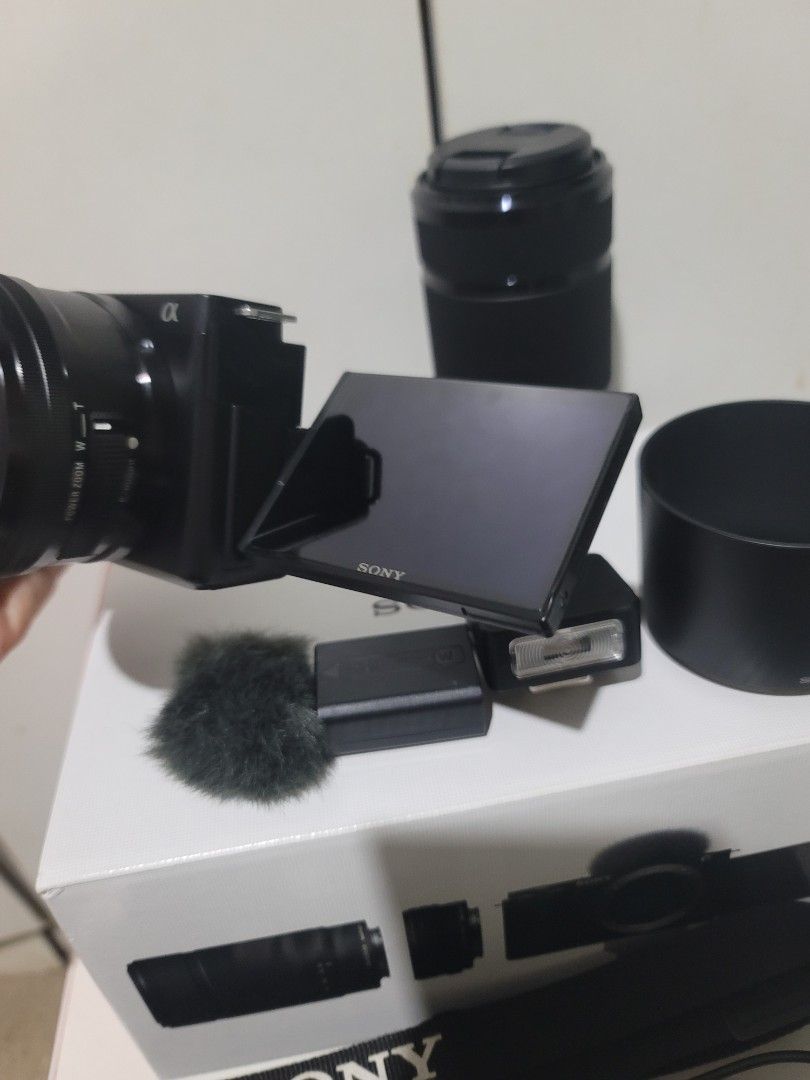 Sony ZV-E10 Complete Set with lenses and flash+accessories (Category: Cameras) located in Cabanatuan. Submitted by mjsabado74120 (Listing ID 1461361236, Image 3). Description: SONY ZV-E10 COMPLETE SET 855 Shutter Count Only✅ (3x lang nagamit sa travel) INCLUSIONS: Sony ZV-E10 Mirrorless Camera Body Sony E PZ 16-50mm F3.5-5.6 OSS Lens + Sony E 55-210mm F4.5-6.3 OSS Zoom Lens Sony NP-FW50 Rechargeable Battery Sony External Flash Windscreen Camera C