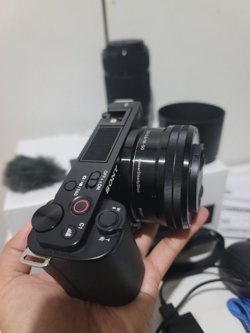 Sony ZV-E10 Complete Set with lenses and flash+accessories (Category: Cameras) located in Cabanatuan. Submitted by mjsabado74120 (Listing ID 1461361236, Image 2). Description: SONY ZV-E10 COMPLETE SET 855 Shutter Count Only✅ (3x lang nagamit sa travel) INCLUSIONS: Sony ZV-E10 Mirrorless Camera Body Sony E PZ 16-50mm F3.5-5.6 OSS Lens + Sony E 55-210mm F4.5-6.3 OSS Zoom Lens Sony NP-FW50 Rechargeable Battery Sony External Flash Windscreen Camera C