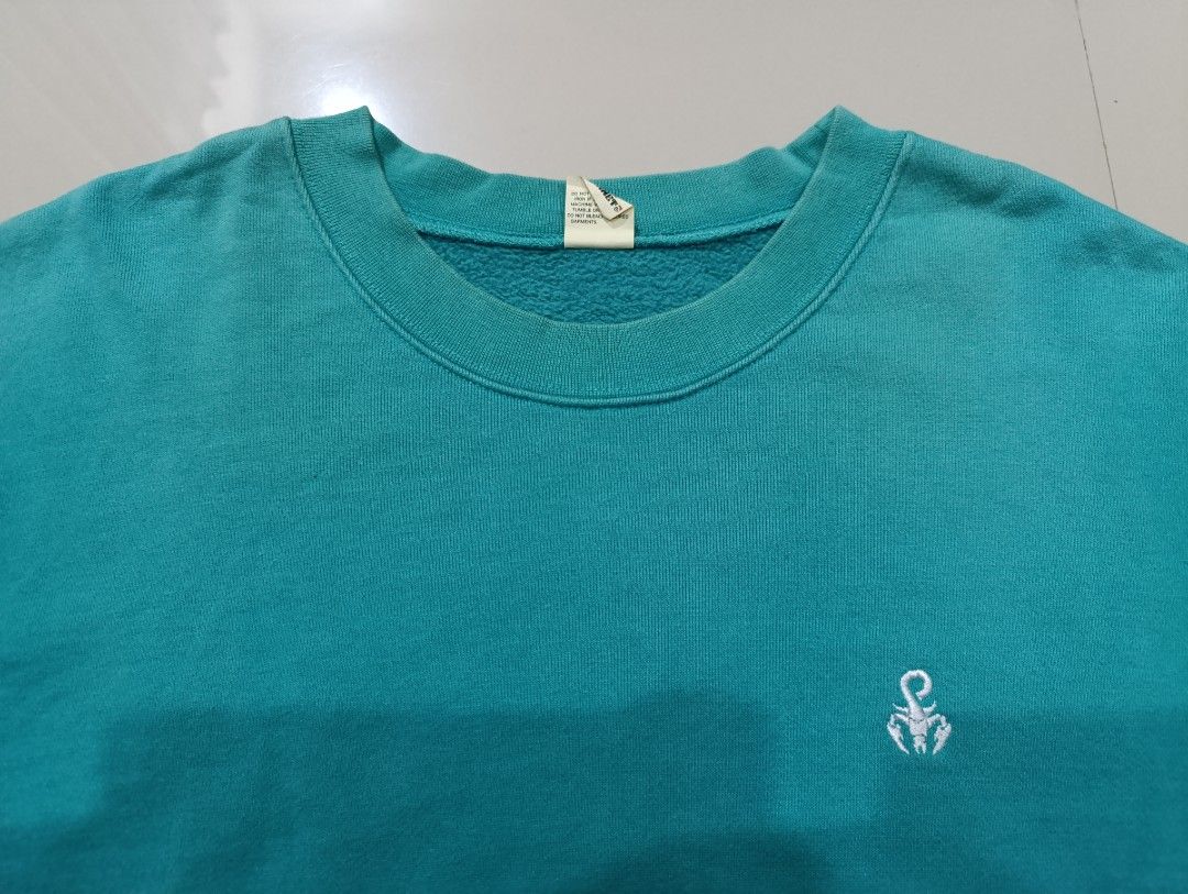 SOPHNET. Screen Stars Sweatshirt Teal Size L (Category: Coats, Jackets and Outerwear) located in Davao. Submitted by idioticthrifter (Listing ID 1461545481, Image 2). Description: - Teal sweatshirt from SOPHNET. and Screen Stars - Features a small embroidered logo on the chest - Made in China - Ribbed cuffs and hem for a comfortable fit - Perfect for casual everyday wear - Refer to label for specific care instructions - issue neck fading -24 x 28
