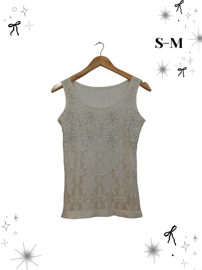 Sparkly Rhinestone & Sequin Tank Tops (Category: Sleeveless) located in Manila. Submitted by dear__riri__ (Listing ID 1461518825, Image 3). Description: - Two white tank tops with rhinestone details and ruching - One white top with delicate lace overlay - One black top featuring a rose rhinestone design and lace trim - One black top adorned with scattered sequins - Versatile for layering or wearing as a standalone piece.