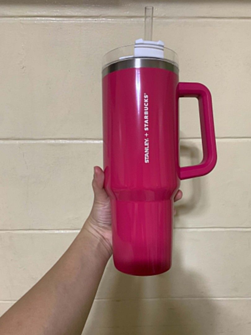 Starbucks collection (Category: Other Food & Drinks) located in Ibaan. Submitted by ljnaig14 (Listing ID 1461358296, Image 1). Description: Stanley x Starbucks Quencher 40 oz tumbler, in a bright pink/sweet-pink style. Details Brand: Stanley x Starbucks Model: The Quencher / FlowState-style tumbler Capacity: 40 oz / approximately 1.18 liters Material: Stainless steel, double-wall vacuum insulated Color: Bright pink / Sweet Pink Features: Large si