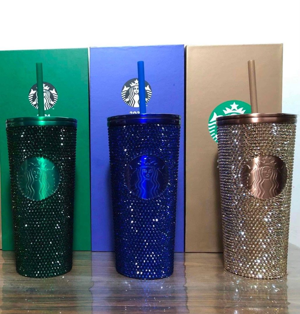 Starbucks collection (Category: Other Food & Drinks) located in Ibaan. Submitted by ljnaig14 (Listing ID 1461362302, Image 1). Description: 9000 each highly collectible Starbucks Rhinestone Tumbler editions, which features dual-wall stainless steel bodies meticulously covered in hand-placed crystals. Green (Left): The Starbucks Emerald Holiday Rhinestone Tumbler. Blue (Center): The Starbucks Sapphire Holiday Rhinestone Tumbler. Rose Gold/Copper (