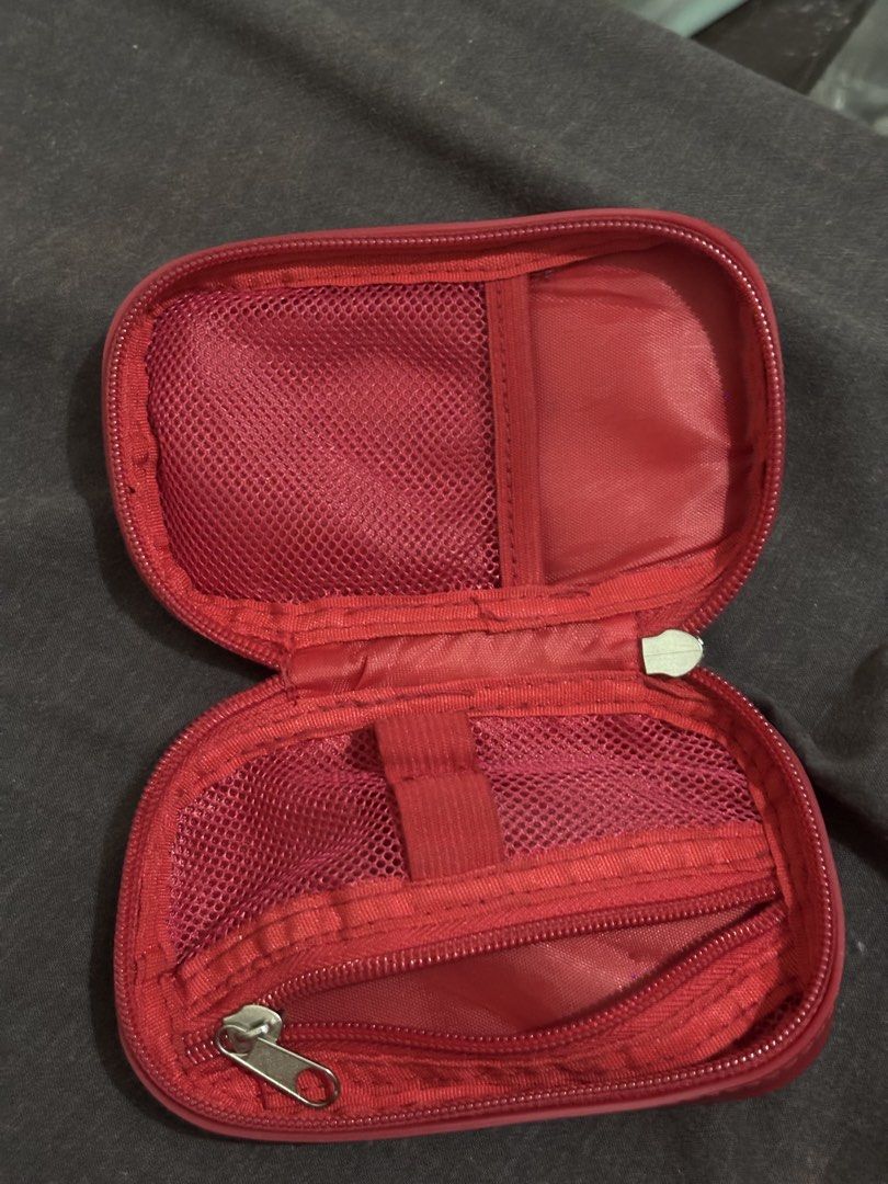 Store It Mini Cloud Organizer Silicone Pouch Keychain | CLASSIC RED COLLECTION | (Category: Purses & Pouches) located in Manila. Submitted by mjg3005 (Listing ID 1461539394, Image 2). Description: - Red silicone pouch from Storeit - Features a convenient keychain loop - Interior includes mesh pockets and elastic straps for organization - Secure zip closure - Ideal for storing earbuds, coins, cards, and other small essentials - Compact and easy to