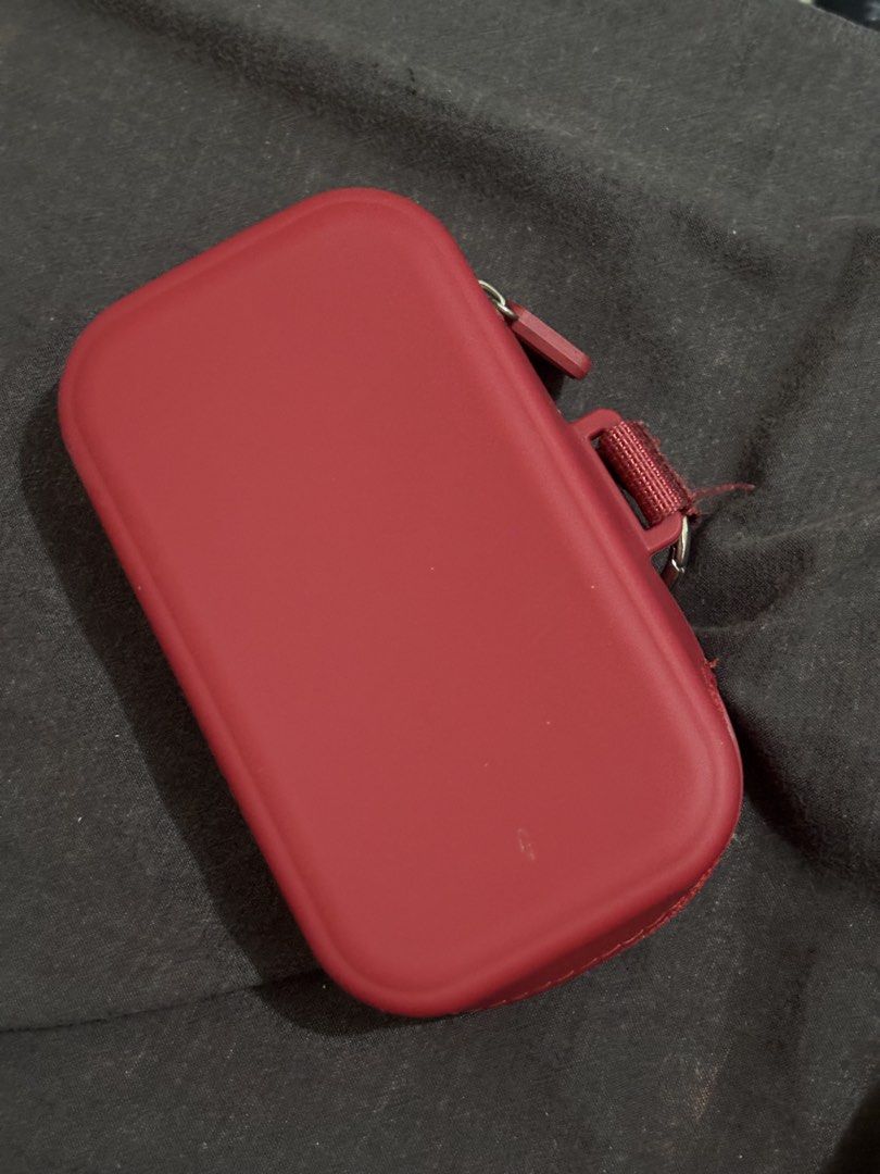 Store It Mini Cloud Organizer Silicone Pouch Keychain | CLASSIC RED COLLECTION | (Category: Purses & Pouches) located in Manila. Submitted by mjg3005 (Listing ID 1461539394, Image 3). Description: - Red silicone pouch from Storeit - Features a convenient keychain loop - Interior includes mesh pockets and elastic straps for organization - Secure zip closure - Ideal for storing earbuds, coins, cards, and other small essentials - Compact and easy to