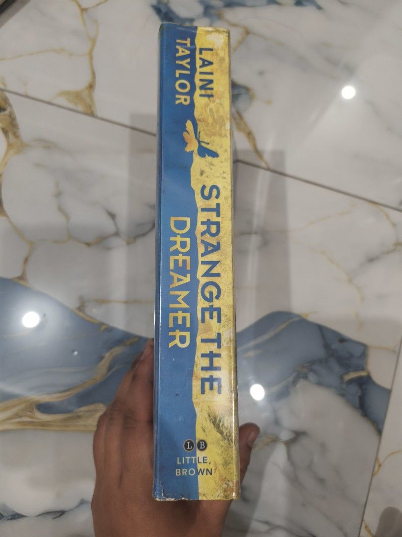 Strange The Dreamer by Laini Taylor (Category: Storybooks) located in Cavite. Submitted by jannede (Listing ID 1461512844, Image 2). Description: self painted edges paperback.