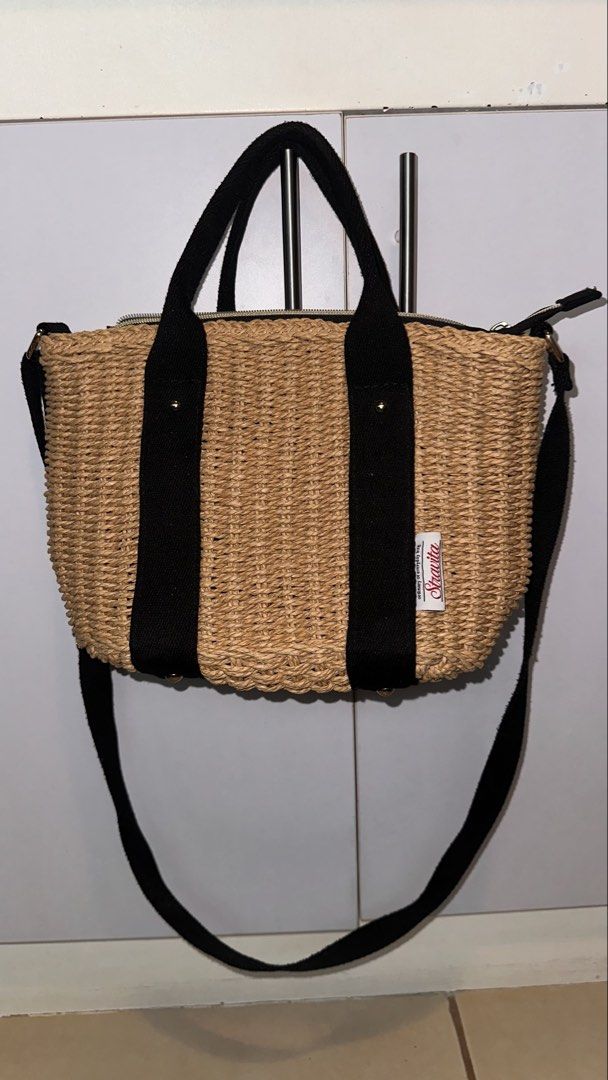 Straw Bag with Black Straps (Category: Shoulder Bags) located in Mandaluyong City. Submitted by TheWeekendProject (Listing ID 1461517115, Image 1). Description: - Cute straw bag with black fabric straps - Zipper closure for security - Detachable shoulder strap for versatility - Brand: Stravita - Ideal for everyday use or beach outings.