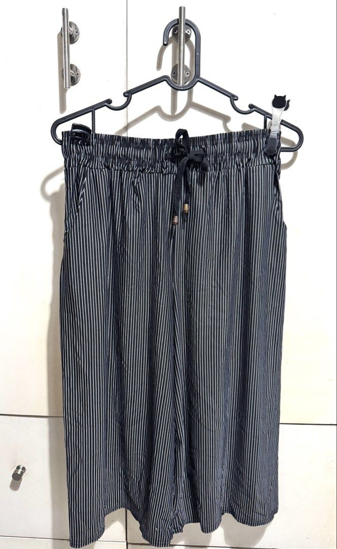 Striped Wide Leg Pants with Drawstring Waist (Category: Other Bottoms) located in Mandaluyong City. Submitted by spaceshipshop (Listing ID 1461462310, Image 1). Description: - Classic black and white stripes - Trendy wide-leg cut for a relaxed fit - Comfortable elastic waistband with adjustable drawstring - Convenient side pockets - Versatile for everyday casual wear - Easy to mix and match with your wardrobe.