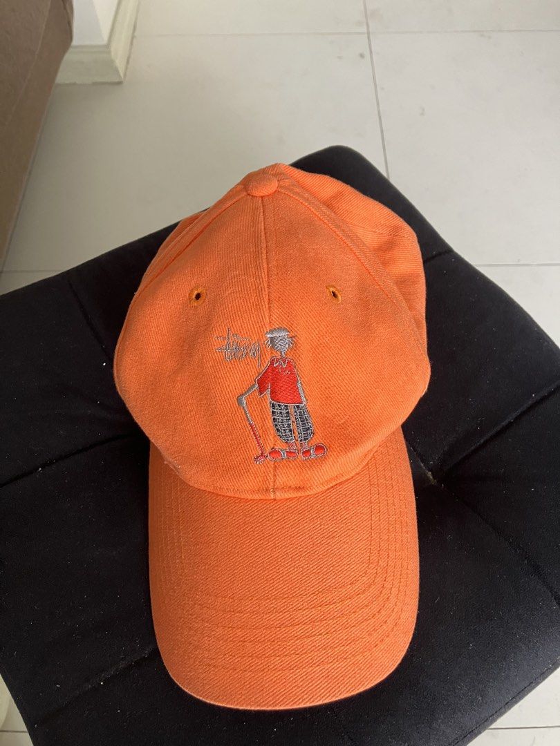 Stussy Orange Cap with Embroidered Graphic (Category: Caps & Hats) located in Paranaque City. Submitted by flipflop.fones (Listing ID 1461447699, Image 1). Description: - Iconic Stussy baseball cap - Features a cool embroidered graphic on the front - Stussy logo embroidered on the back - Classic, comfortable fit - Ideal for sunny weather and everyday wear.