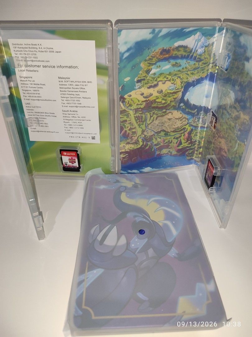 Switch - Pokemon Shield, Pokemon Violet + Steel Case Bundle (LIKE NEW) "MDE" (Category: Nintendo) located in Mendez-Nunez. Submitted by sf2_gameshop (Listing ID 1461352203, Image 2). Description: PLEASE READ In this bundle, you'll get three items: 1. Pokemon Shield 2. Pokemon Violet 3. Pokemon Violet Steel Case - Unopened/untouched since I bought it. CONDITION: Like new - no dents creases or any damaged. Clean pins, the plastic cases look new as 