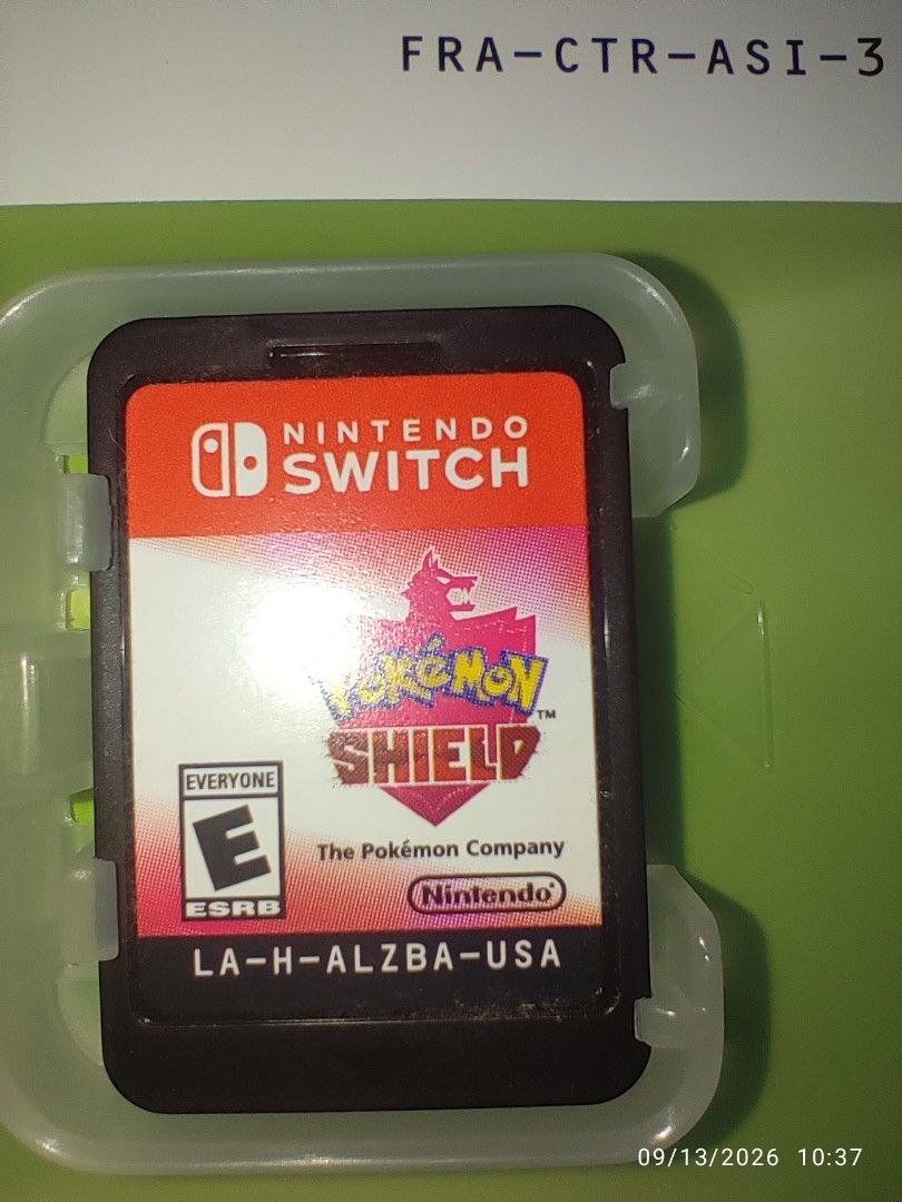 Switch - Pokemon Shield, Pokemon Violet + Steel Case Bundle (LIKE NEW) "MDE" (Category: Nintendo) located in Mendez-Nunez. Submitted by sf2_gameshop (Listing ID 1461352203, Image 3). Description: PLEASE READ In this bundle, you'll get three items: 1. Pokemon Shield 2. Pokemon Violet 3. Pokemon Violet Steel Case - Unopened/untouched since I bought it. CONDITION: Like new - no dents creases or any damaged. Clean pins, the plastic cases look new as 