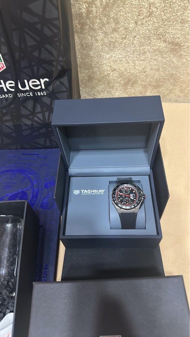 TAG HEUER FORMULA 1 CHRONOGRAPH Automatic 44mm Titanium (Category: Men's Watches) located in Caloocan City. Submitted by camz0927 (Listing ID 1461498151, Image 3). Description: - Brand: TAG HEUER - Model: FORMULA 1 CHRONOGRAPH - Model Number: CBZ2082.FT8096 - Movement: Automatic - Case Size: 44mm - Case Material: Titanium - Dial: Black with red accents - Strap: Black rubber - Condition: Great for watch enthusiasts.