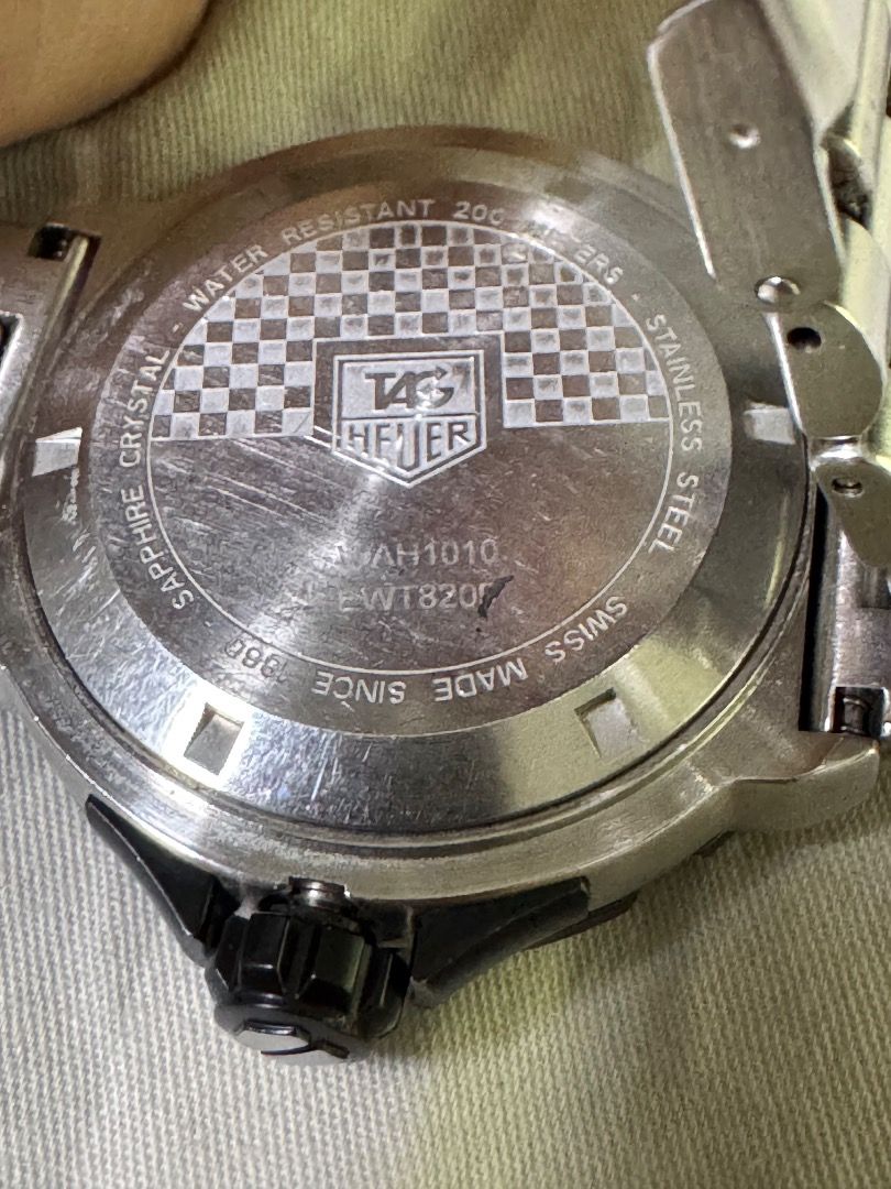 TAG Heuer Formula 1 Watch AH1010 (Category: Men's Watches) located in Caloocan City. Submitted by dave235 (Listing ID 1461464224, Image 3). Description: - Authentic TAG Heuer Formula 1 Watch - Model: AH1010 / EWT820J - Dial: Black with white markers - Band: Stainless Steel - Water Resistance: 200 meters - Crystal: Sapphire - First Owner - Includes: Original Box and Warranty Card (dated 26 Dec 2001).