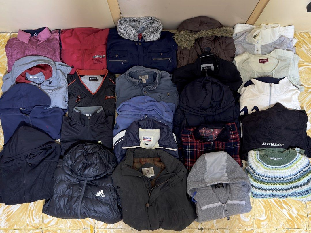TAKE ALL Bundle of Jackets, Coats, and Sweaters (Category: Coats, Jackets and Outerwear) located in Pulilan. Submitted by _sevegn (Listing ID 1461387620, Image 1). Description: - Bundle of assorted outerwear items - Includes puffer jackets, hoodies, denim shirt, Srixon golf jacket, and a patterned sweater - Features brands like Adidas, Dunlop, and Srixon - Versatile mix for various weather conditions - All items are clean and ready for a new owne