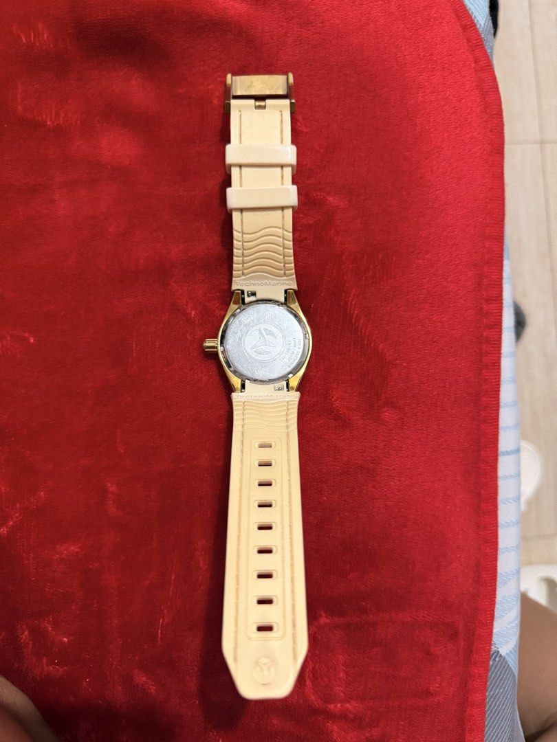TechnoMarine Cruise Monogram Gold Dial Preloved Watch (Category: Women's Watches) located in Bulacan. Submitted by meandmylvonlineshop (Listing ID 1461558814, Image 3). Description: - Preloved TechnoMarine Watch - Gold-tone case - Textured dial with monogram pattern - Day and date display - Genuine beige/white silicone strap - Water resistant up to 200 meters - No original box or papers included.