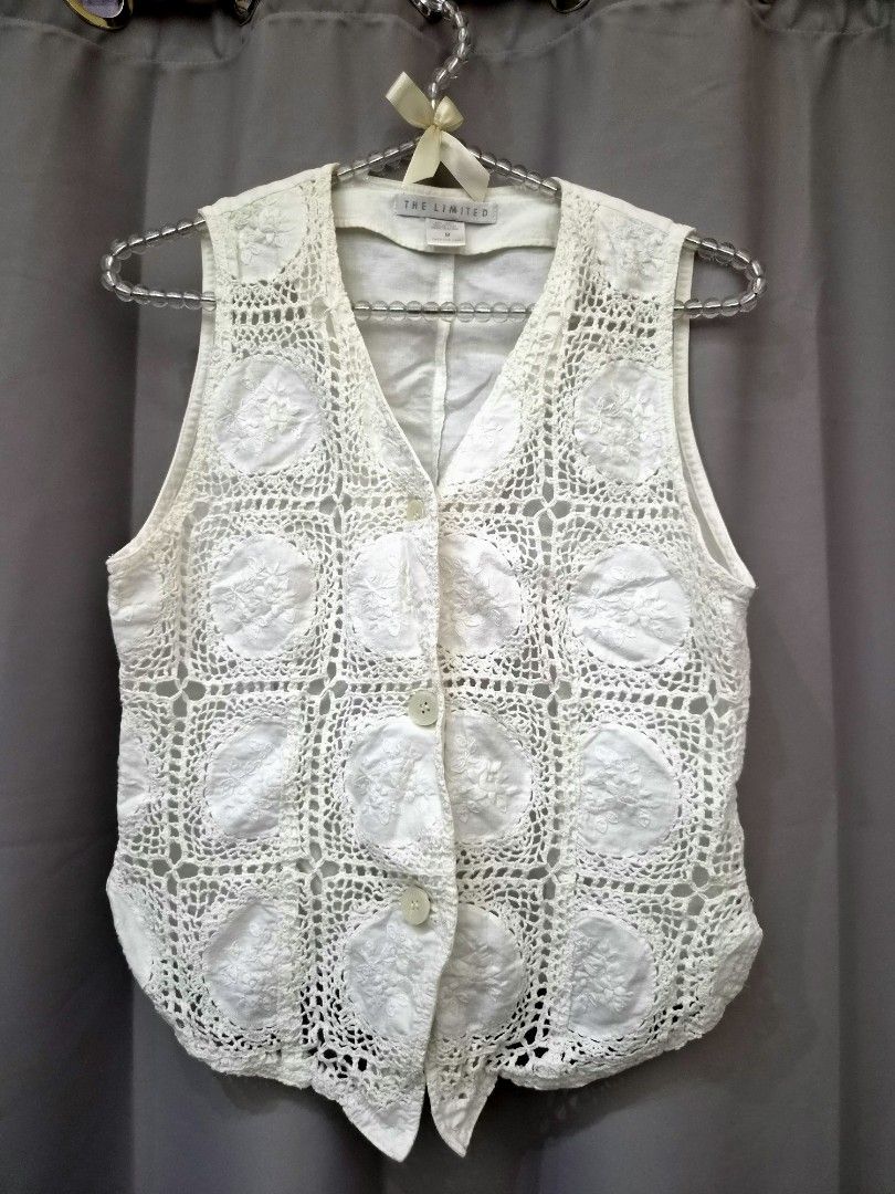 The Limited White Crochet Button-Up Vest (Category: Sleeveless) located in Manila. Submitted by manoygoodies (Listing ID 1461399933, Image 1). Description: - White crochet vest from The Limited - Features a button-up front - V-neckline - Unique circular embroidered details in the crochet pattern - Ideal for layering over tops or dresses - Great for warmer weather styling.